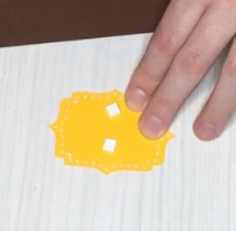 add foam tape to pop up the yellow tag on the diy napkin ring
