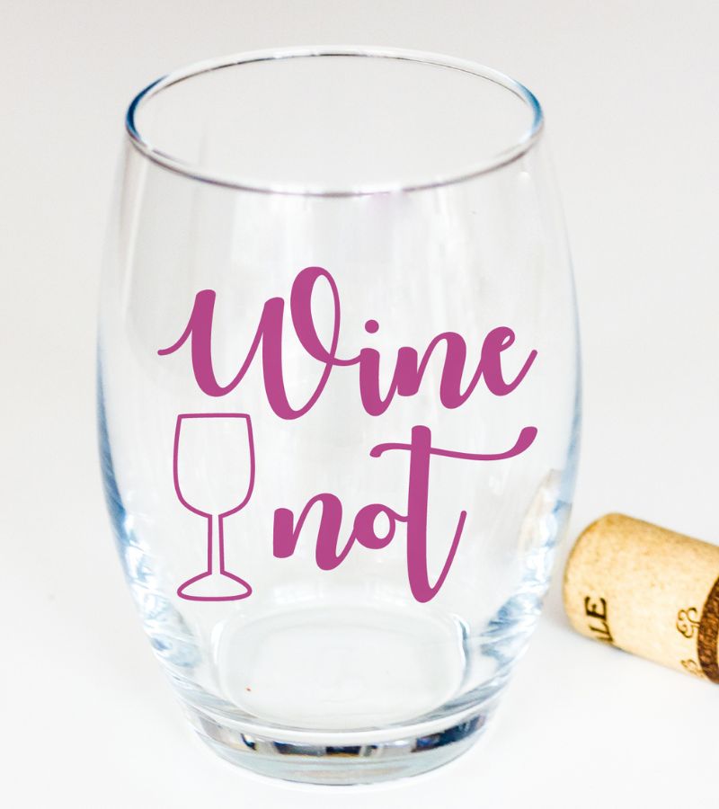 mauve "wine not" vinyl decal on a stemless wine glass