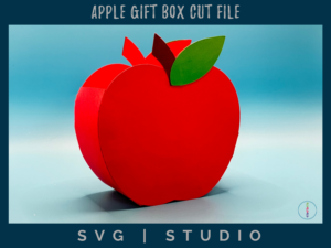 photo of the apple gift box assembled. Its a red apple with a brown stem and green leaf. 2 inches wide box.