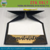 Graduation cap card laying on table